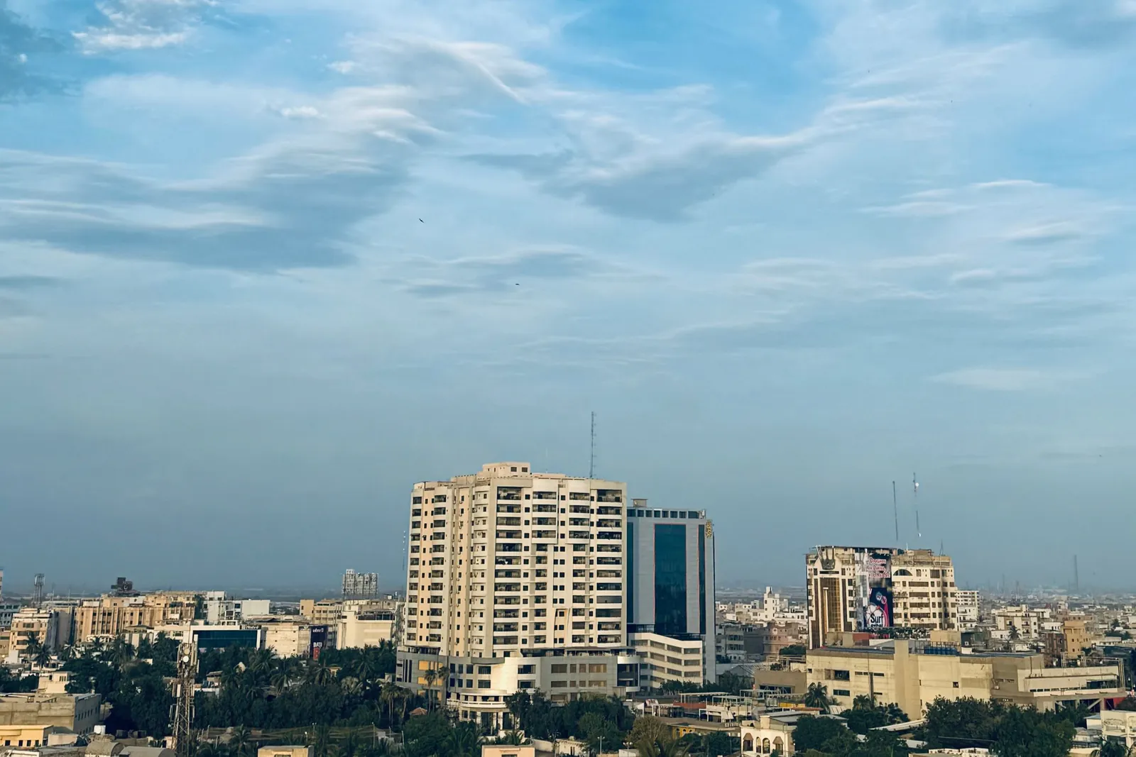 Karachi skyline with high-rise buildings under a blue sky