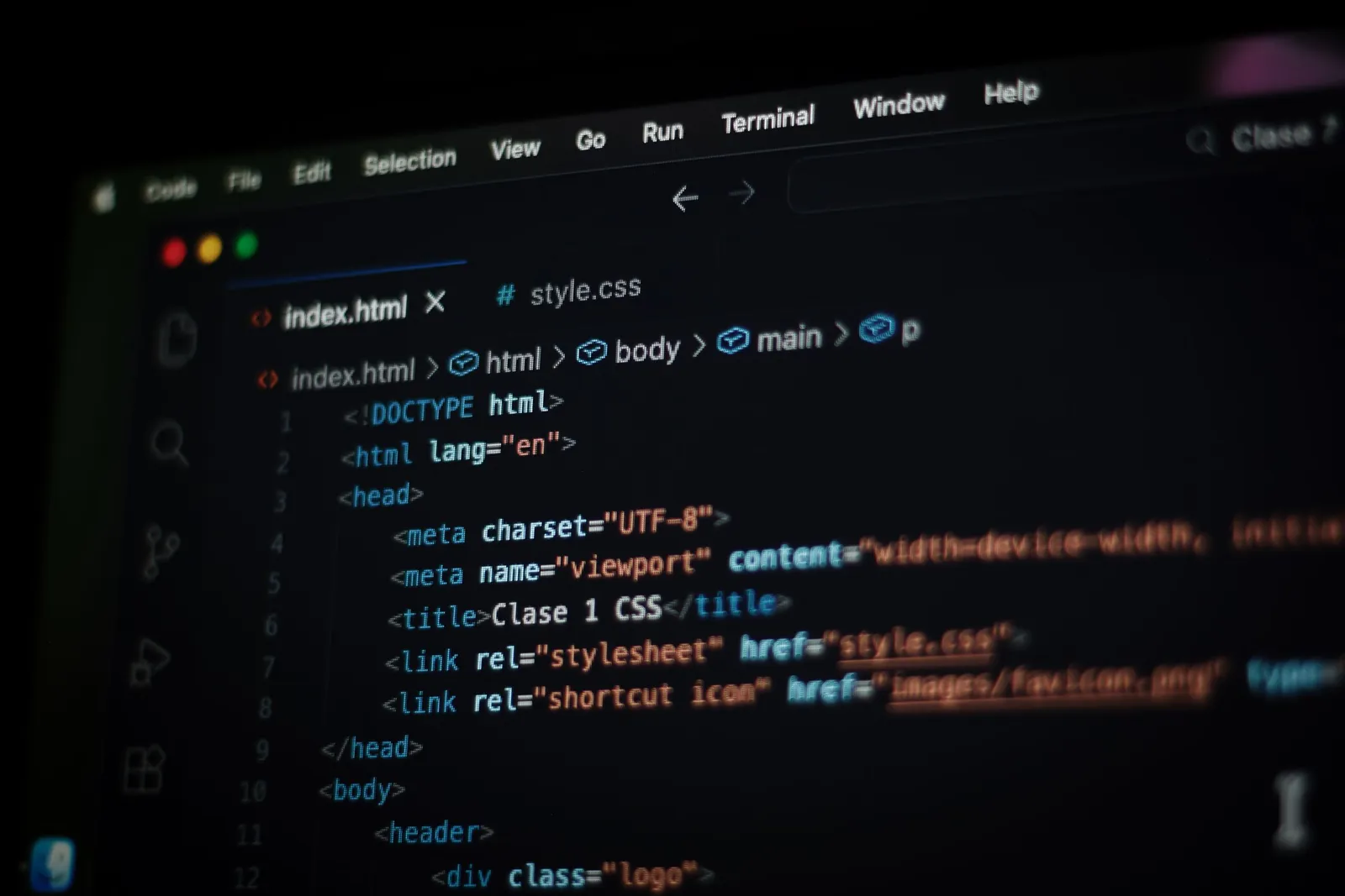 HTML code for a business website open in a code editor in dark mode